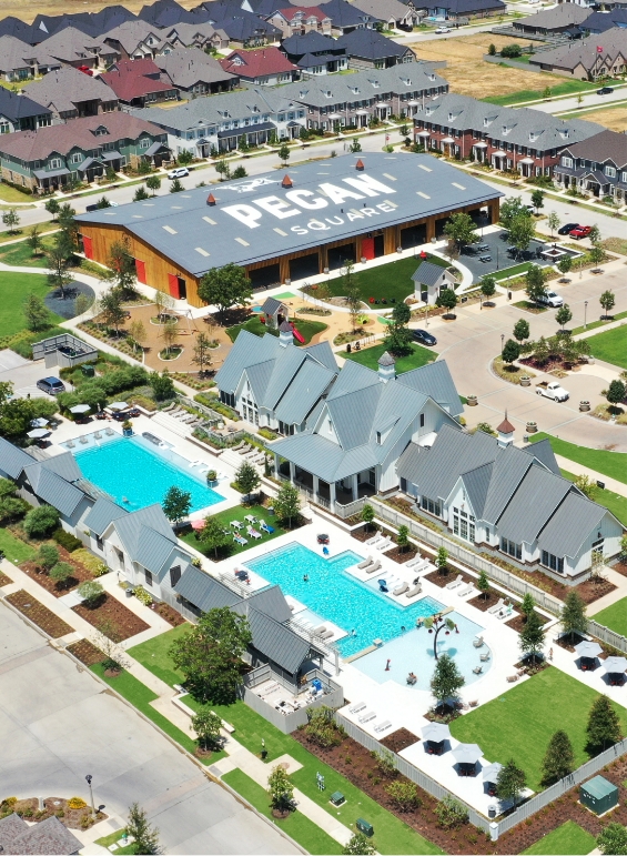 A bird's eye view of the pool and amenity building at Pecan Square