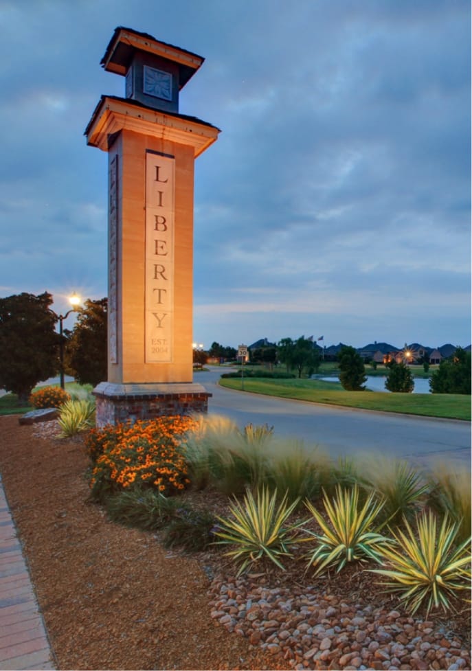 The entry stone pillar at Liberty with the fountain in the background