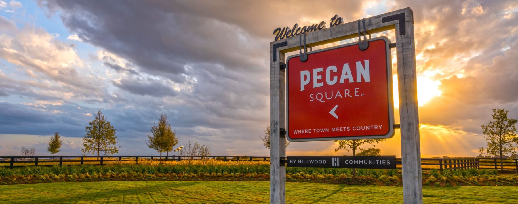 The sign at the entrance to Pecan Square