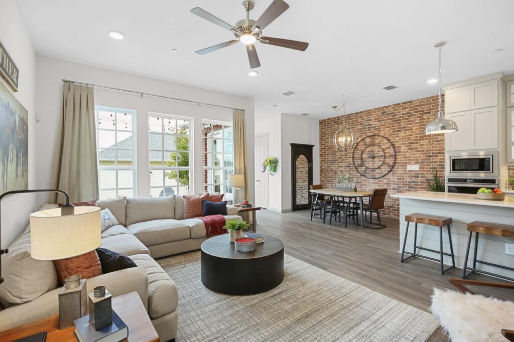 An interior of a home with a beautiful living room and kitchen