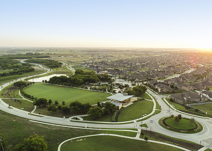 A bird's eye view of a park and homes at a Lifestyle by Hillwood community