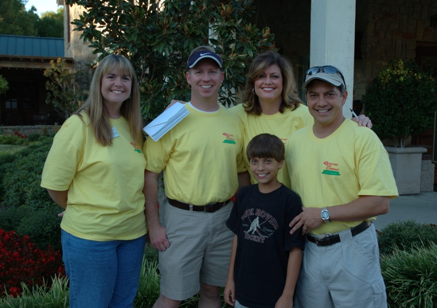 A group of 4 volunteers at a Heroes for Children event