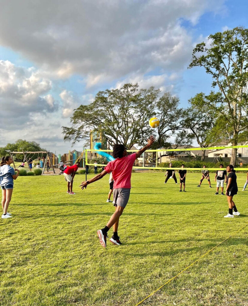 People playing volleyball at the park in Pomona